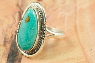 Genuine Crow Springs Turquoise set in Sterling Silver Ring. The Crow Springs Mine is located near Tonopah, Nevada. Created by Navajo Artist Larson Lee. Signed by the artist.